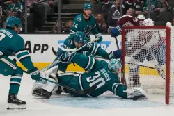 Sharks beat Avalanche in OT, lose defenseman to injury