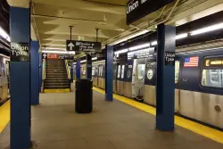 Man charged with slashing 2 others on Queens subway platform